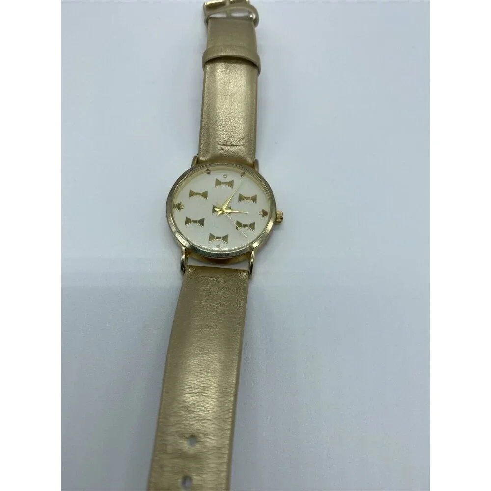 Geneva Platinum No.9880 Women's Gold Band White Face Watch w/ Gold Bowties